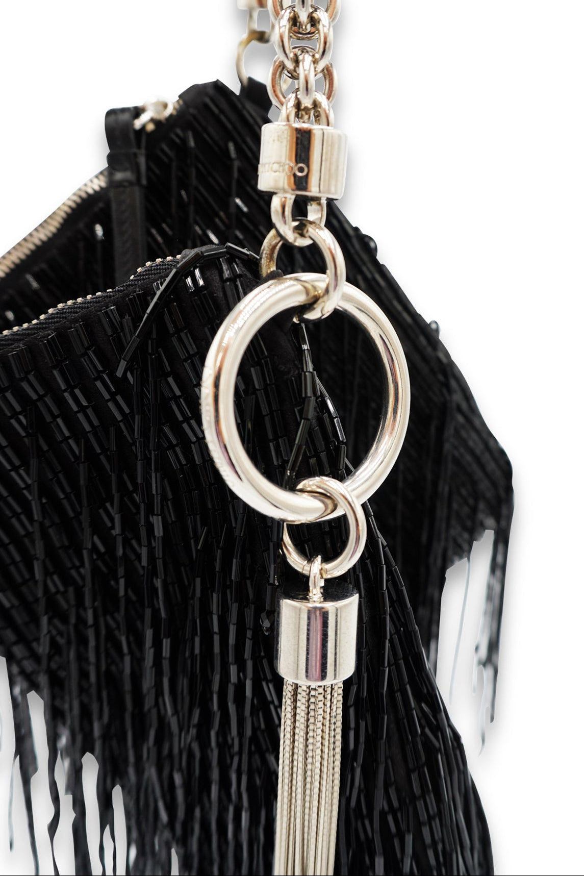 Black handbag with silver chain and tassel